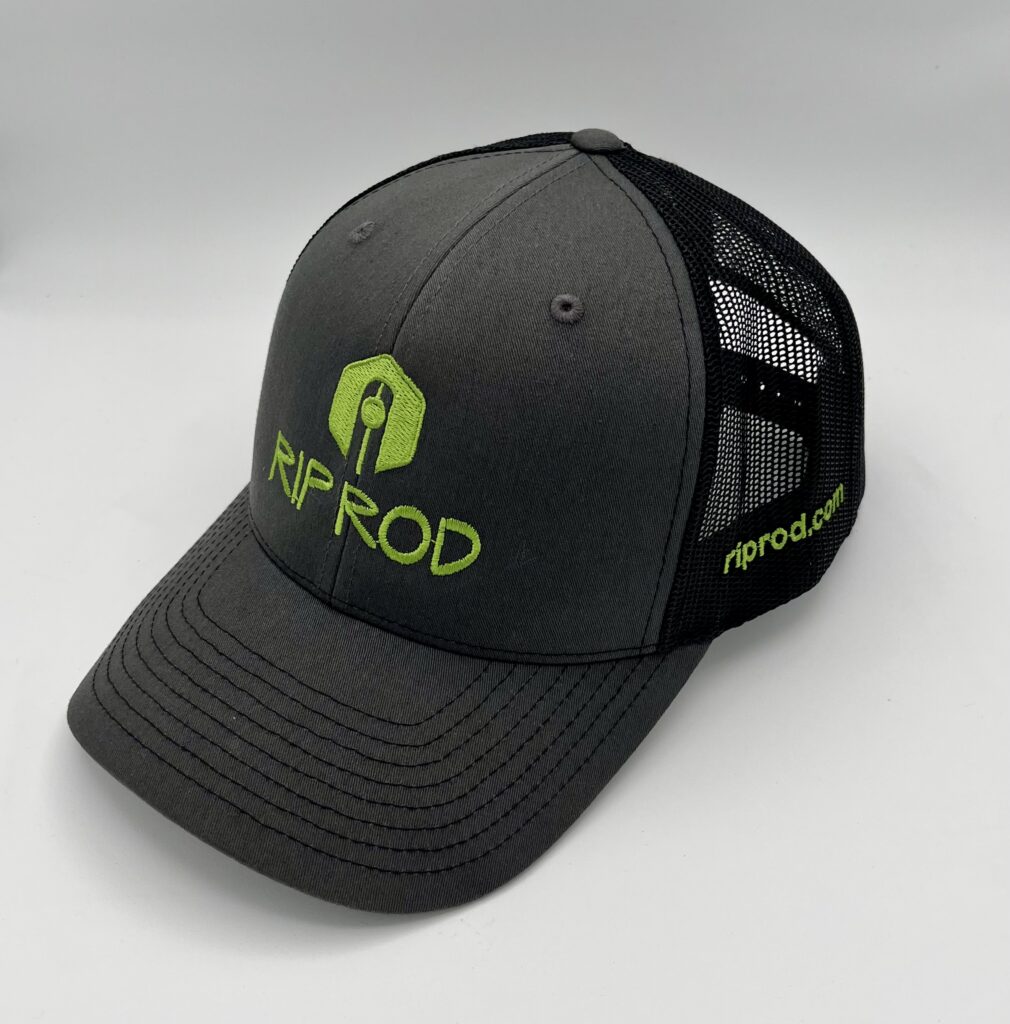The Rip Rod Trucker Cap is a dark gray hat with a black mesh back, neon green "RIP ROD" logo, and "riprod.com" on the side.