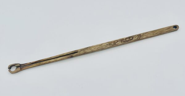 A long, wooden tool with a narrow handle and a small circular clamp at one end, featuring the word "PRODYNE" engraved on the side, displayed on a plain white background.